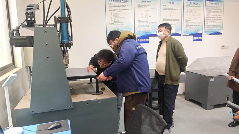 The-Korean-audit-team-enters-the-testing-workshop-edited
