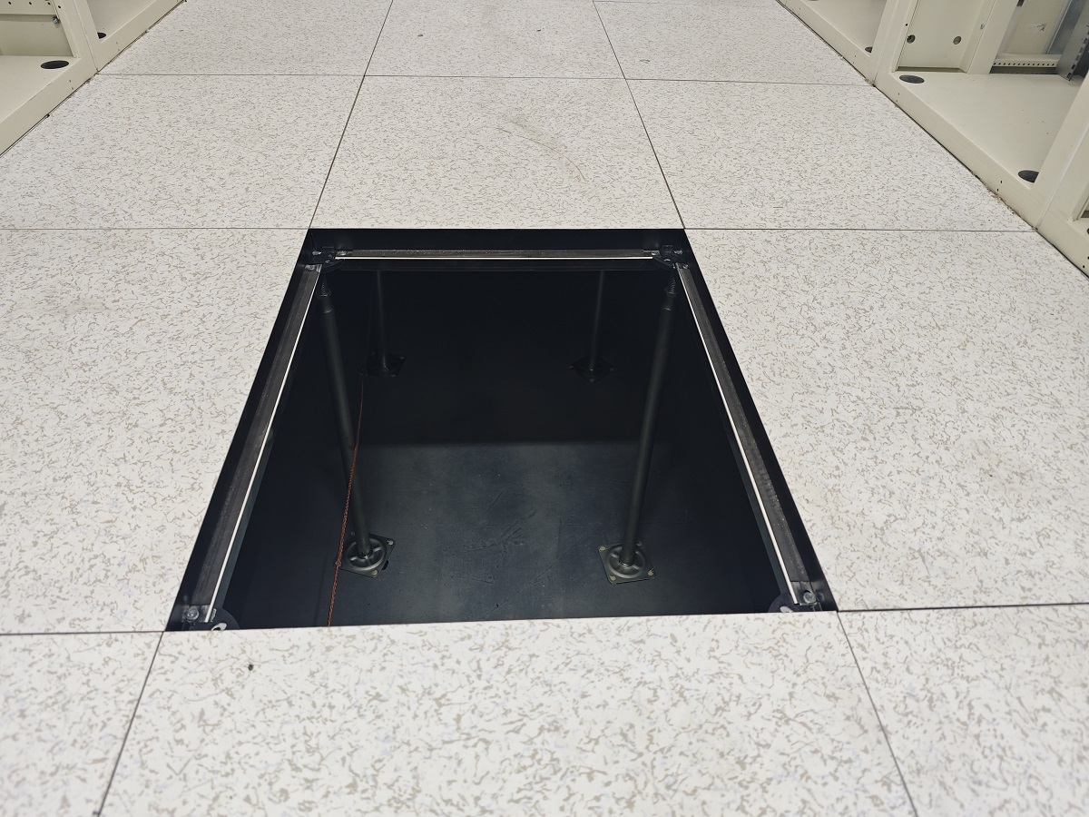 Shanghai data center anti-static raised floor installation showing incorrect panel specification - wood-core panels replaced after moisture failure